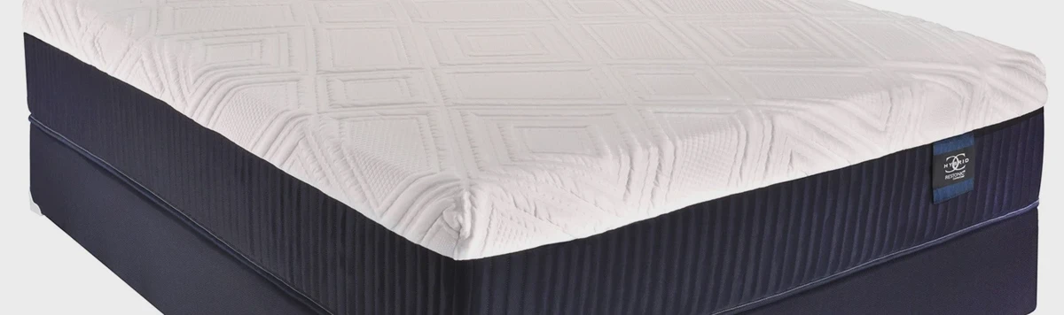 Side profile of the Restonic ComfortCare Level 3 mattress showing height and quilted top