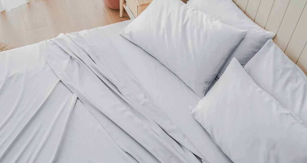 White bamboo sheets air-drying in soft natural light