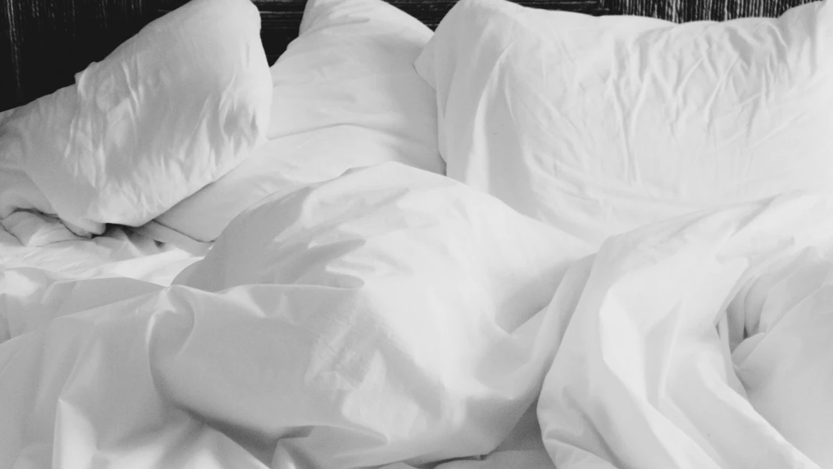 Folded bamboo sheets stored neatly on a bed
