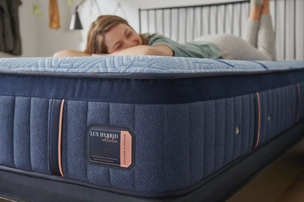 Stearns & Foster Lux Hybrid mattress on a platform bed in a bright bedroom