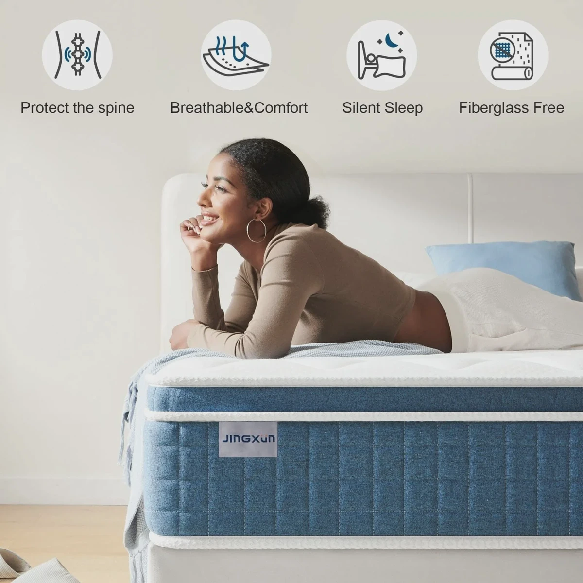 Cross-section of a Jingxun-style hybrid mattress showing memory foam over pocket coils