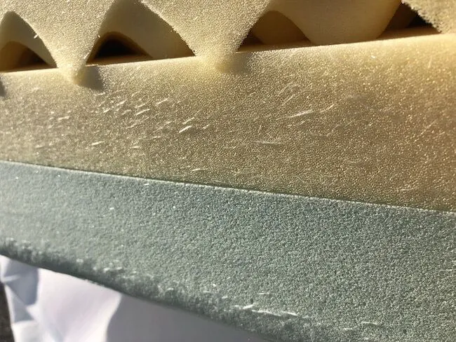 Nectar memory foam mattress on a low platform bed in a neutral bedroom