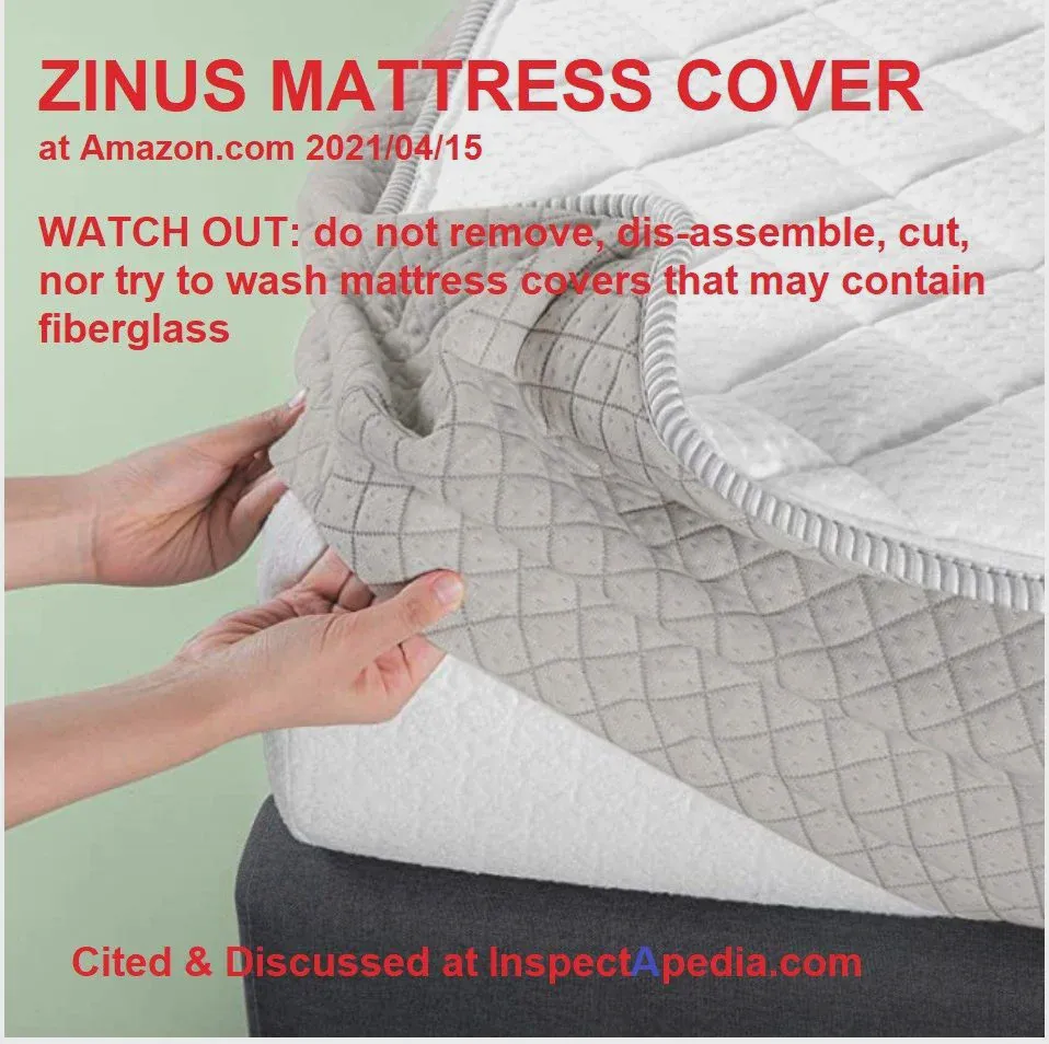Inner mattress cover showing the printed do-not-remove warning that signals fiberglass content