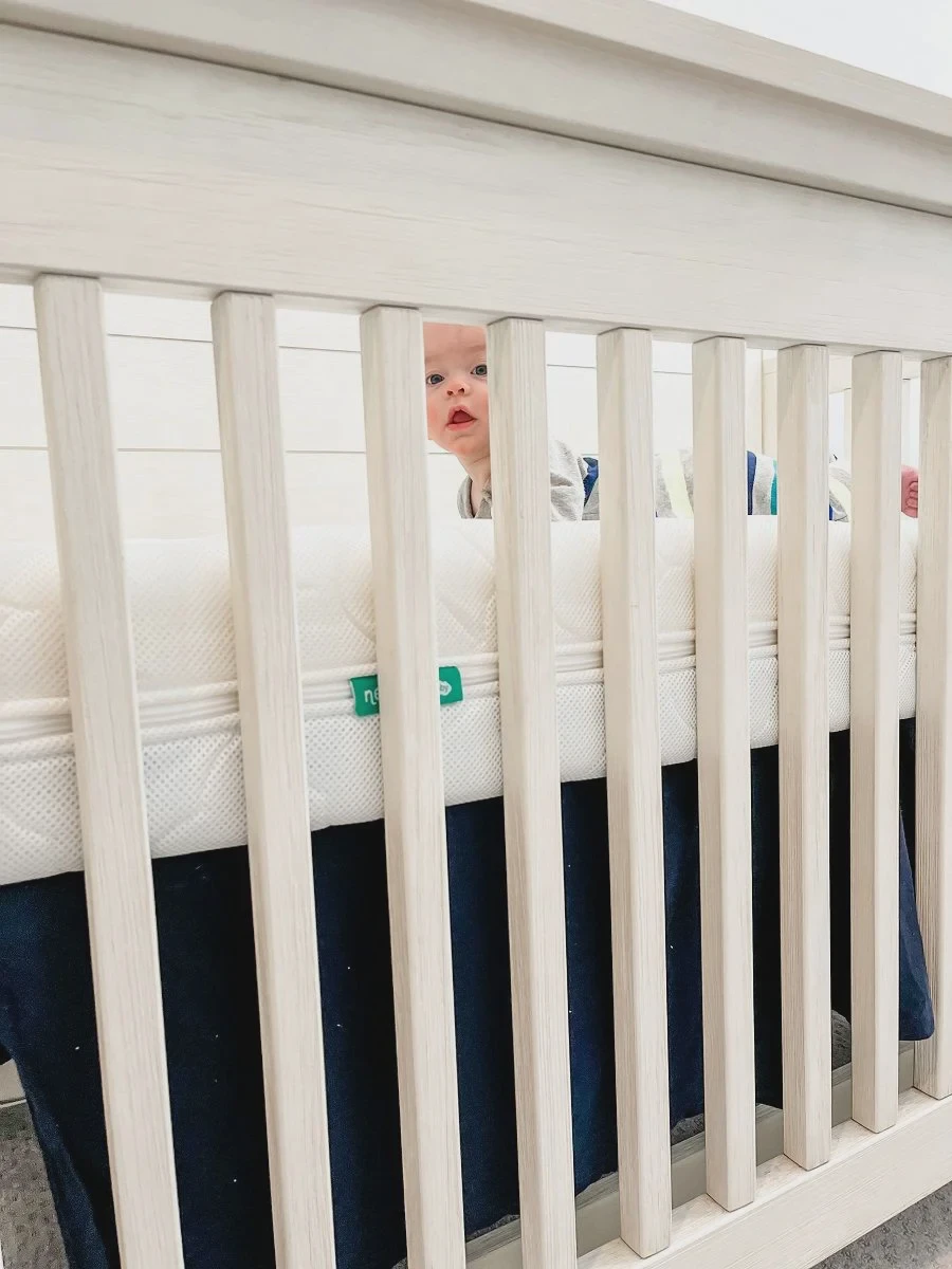Newton crib mattress cover unzipped and pulled away from the Wovenaire core