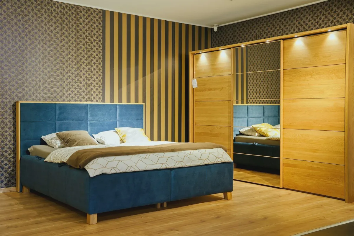 Mattress sitting on a tall foundation in a modern bedroom