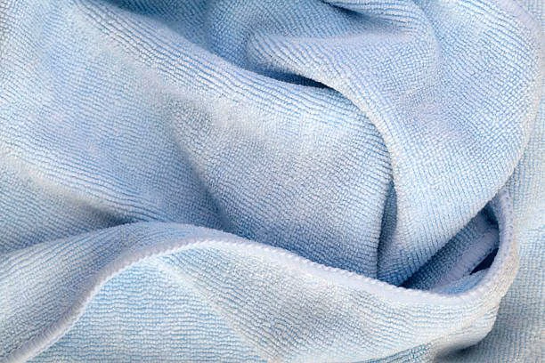 Soft microfiber sheet folded on a bed
