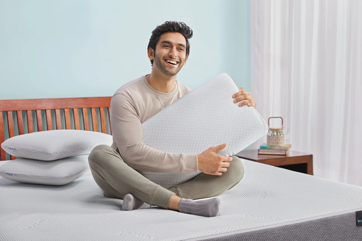 Person resting head on a memory foam pillow