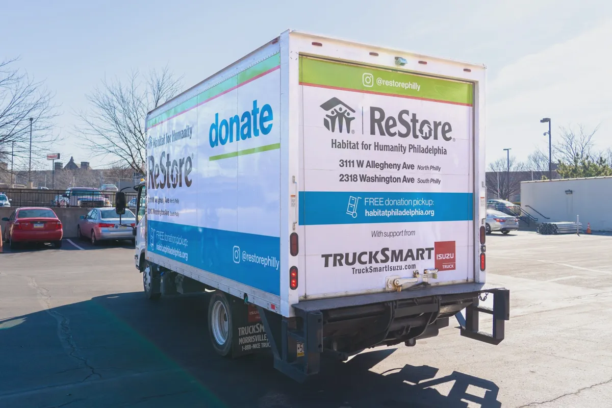 Habitat for Humanity ReStore donation truck picking up furniture