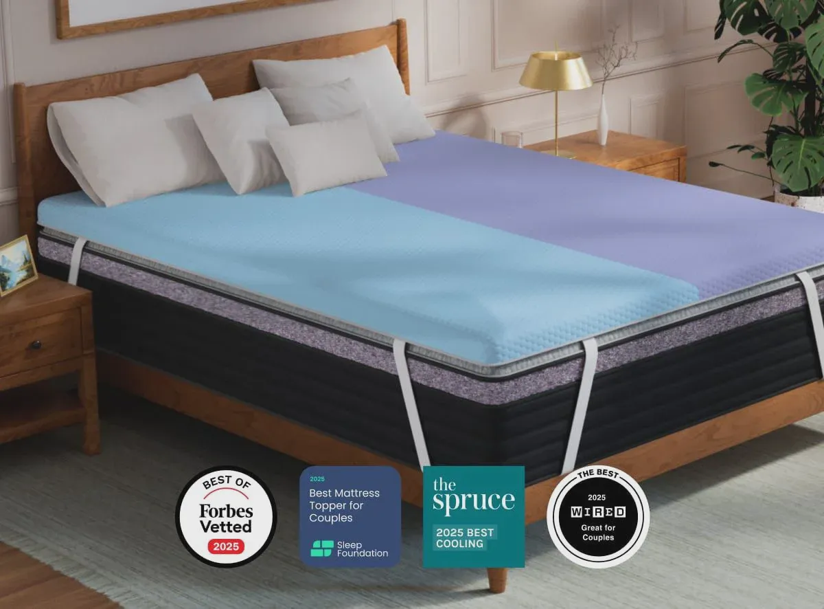 Cross-section view of a layered foam mattress topper showing different firmness zones