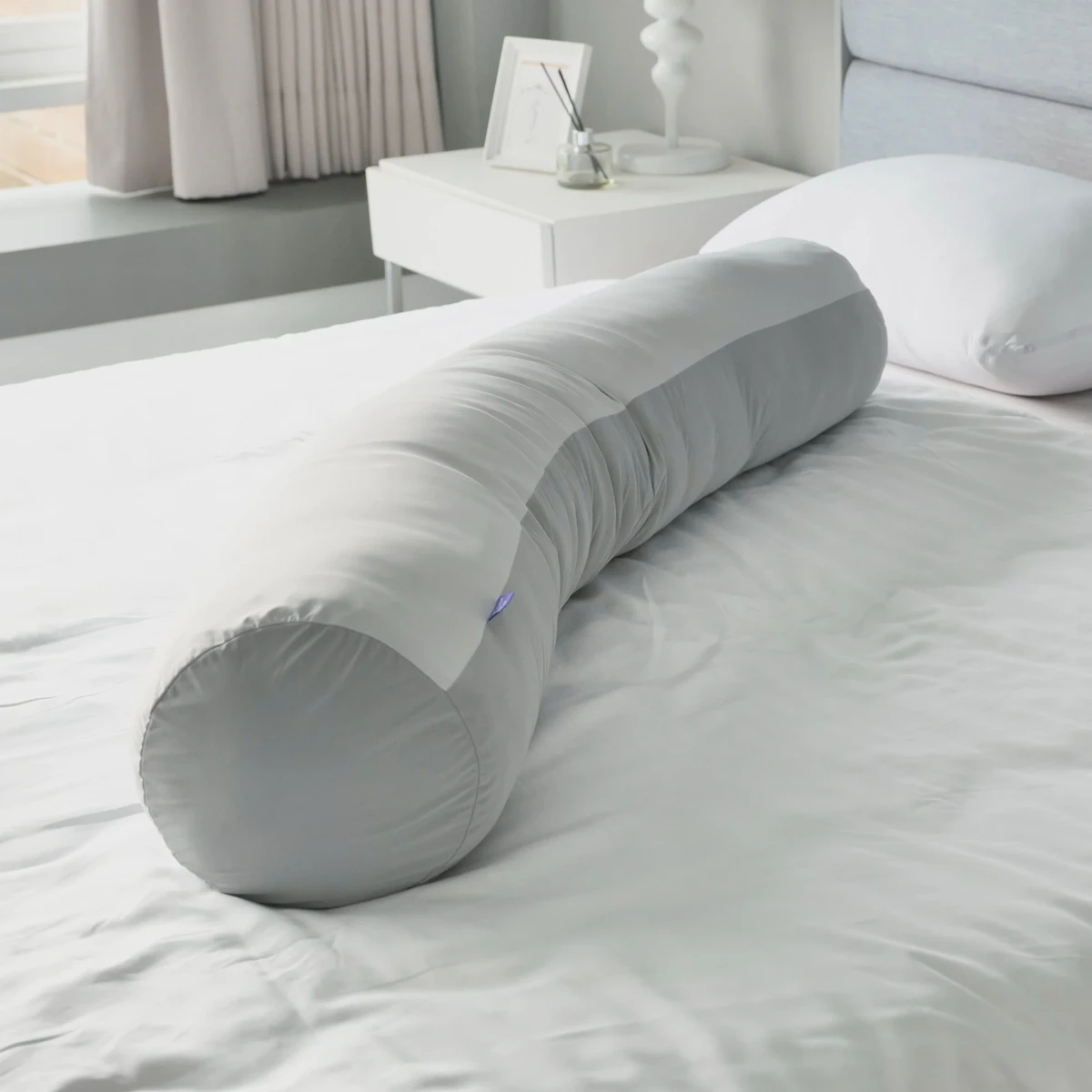 Side sleeper on a cushioned bed, showing how a thicker topper relieves shoulder and hip pressure