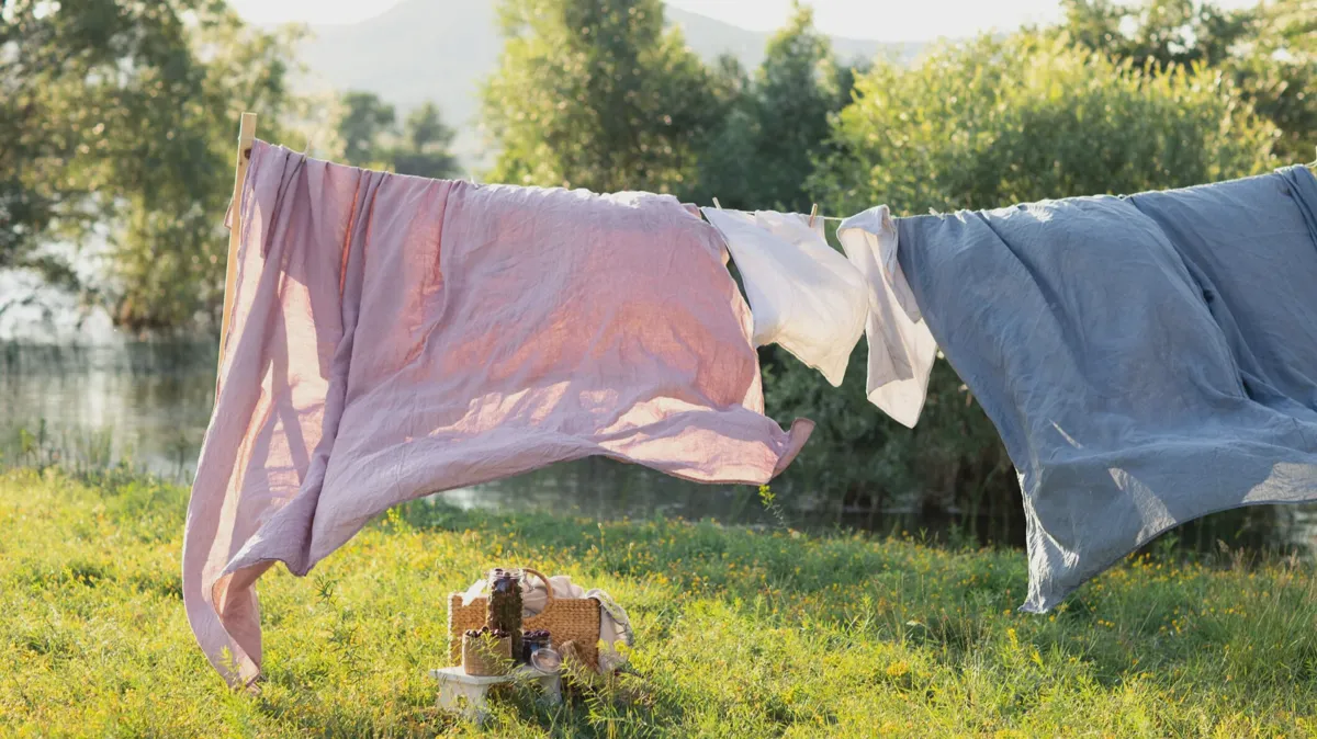 Mattress propped on its side outside in direct sunlight to finish drying