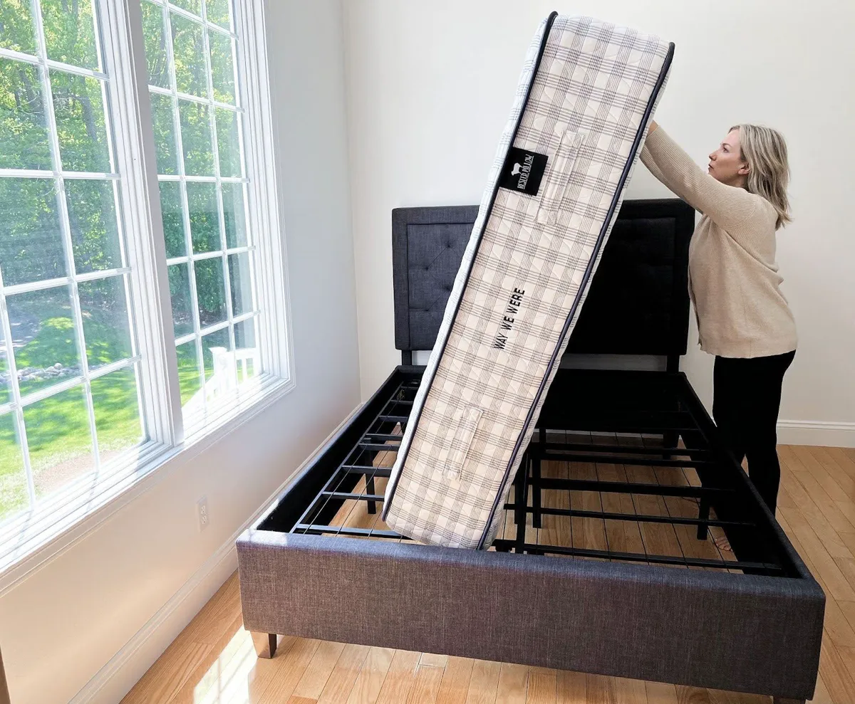 Person rotating a mattress 180 degrees from head to foot