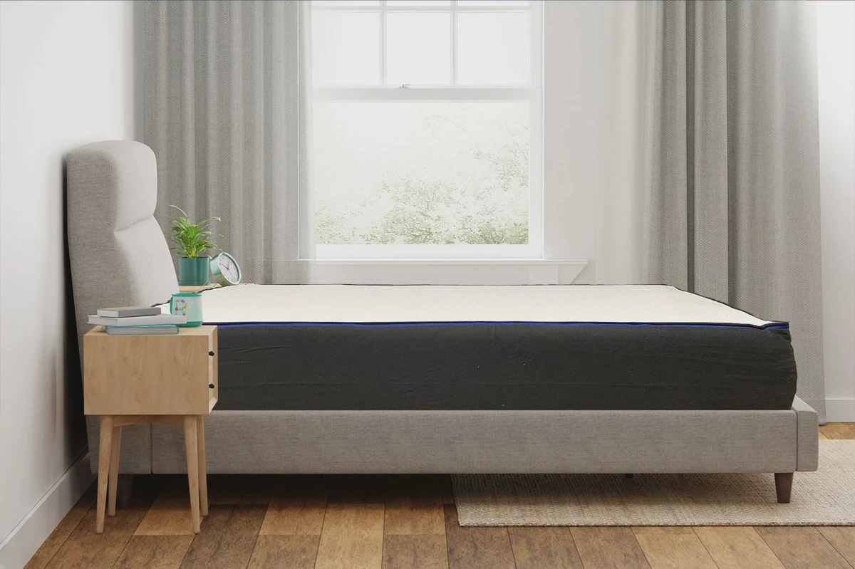 Side profile of an unboxed Nectar memory foam mattress showing the layered foam construction