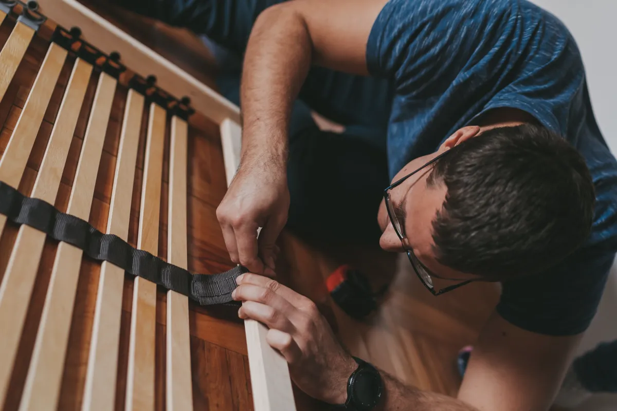 Wooden bed slats with wide gaps that can contribute to mattress sagging