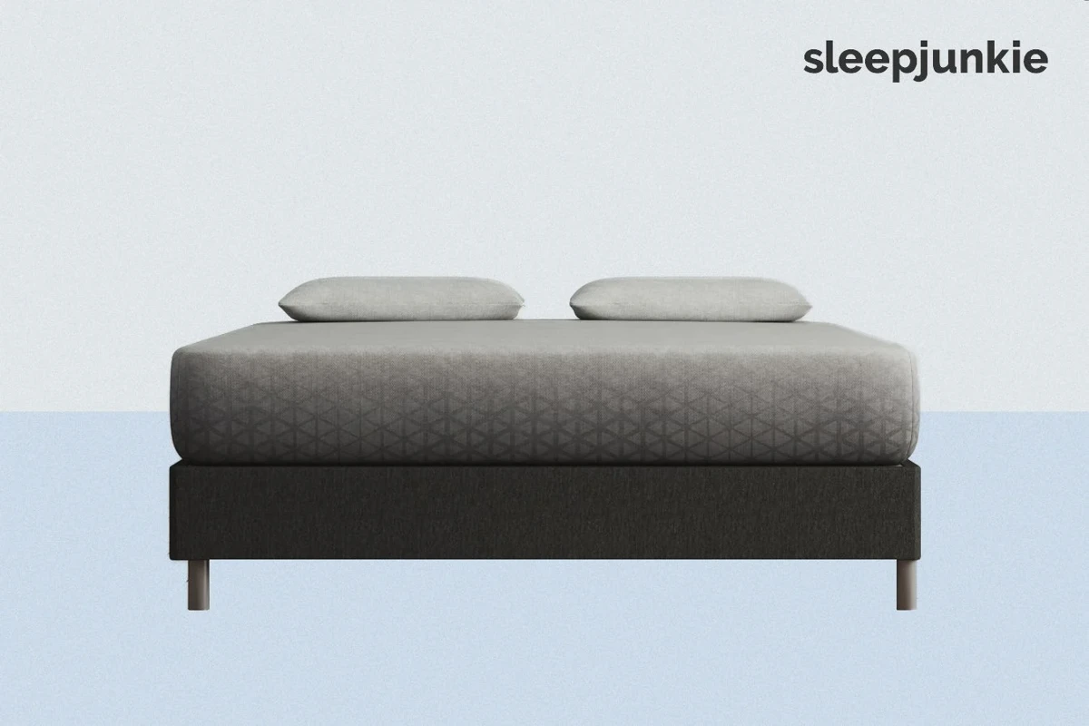 Zoma Hybrid mattress shown without sheets, exposing the knit polyester cover