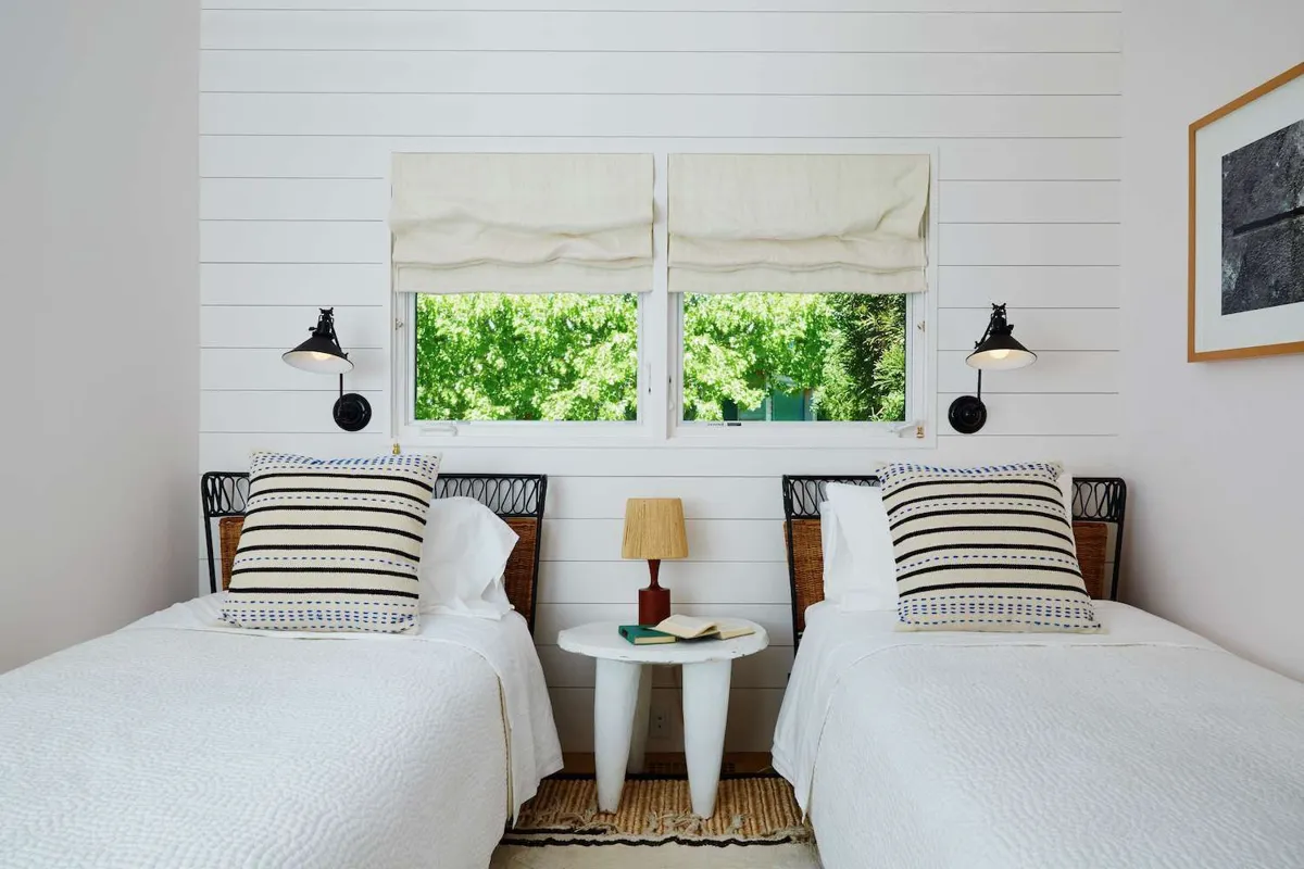 Twin bed styled as a guest-room bed