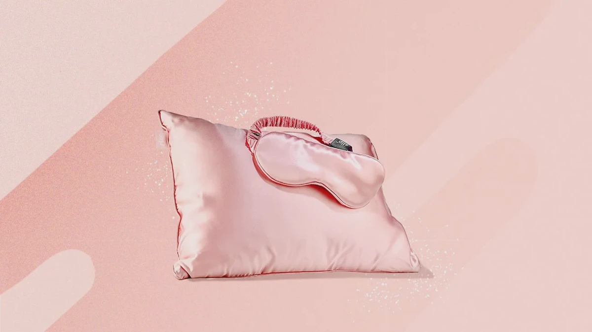 Close-up of a copper-toned pillowcase showing its smooth, silky surface