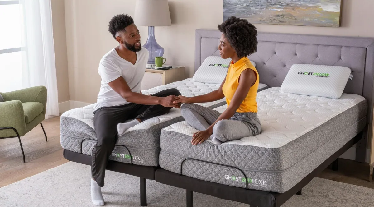 Couple on a split king mattress with adjustable base raised on one side