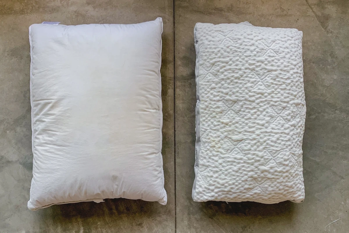Clean white pillows fluffed and stacked after laundering