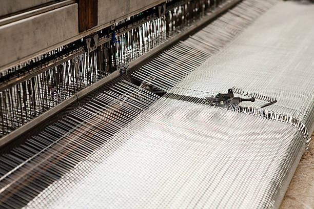 Fiberglass is drawn into the fabric.