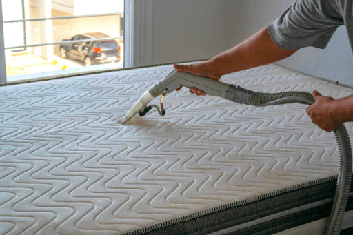 Vacuuming your mattress to remove loose dirt and debris.